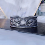 DoubleDragonsPlayingwithBeadshollowoutOpenBracelet-SterlingSilver.jpg