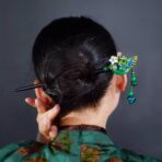 Elegantgreenandgoldhairpinwithcloisonnephoenixandstoneplumblossominlay.jpg