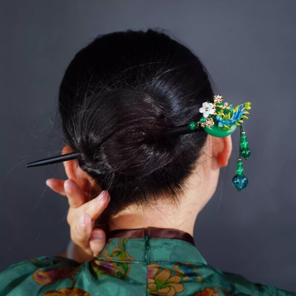 Elegantgreenandgoldhairpinwithcloisonnephoenixandstoneplumblossominlay.jpg