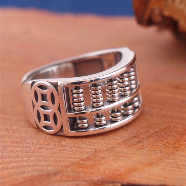 silverChineseCalculatorand4copperRing.jpg